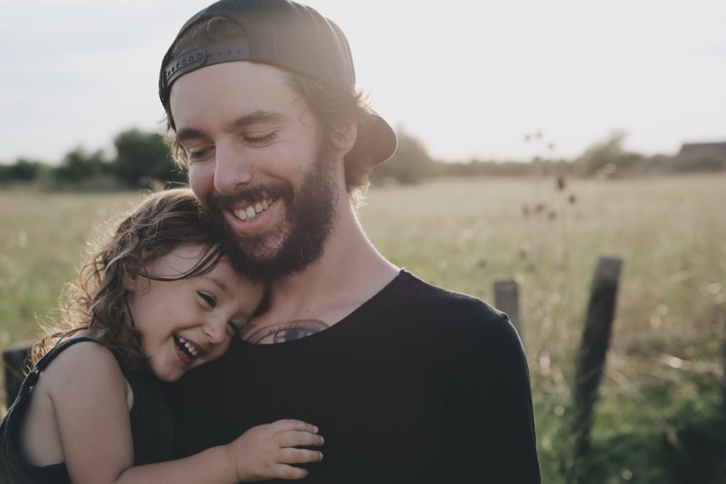 man with child in his arms